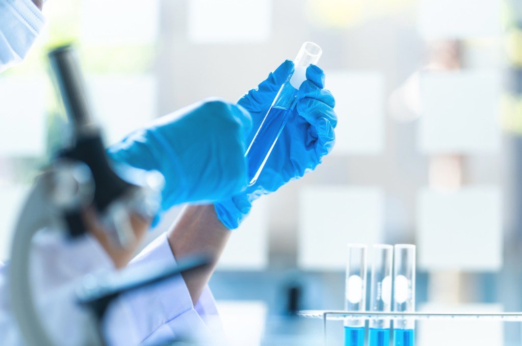 Researcher holding a laboratory sample in a life sciences lab